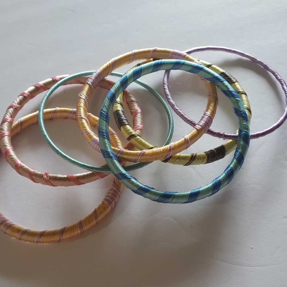 RJ Graciana Custom Colorful Silk Thread-Wrapped Bangles Set Of Seven. $35.00